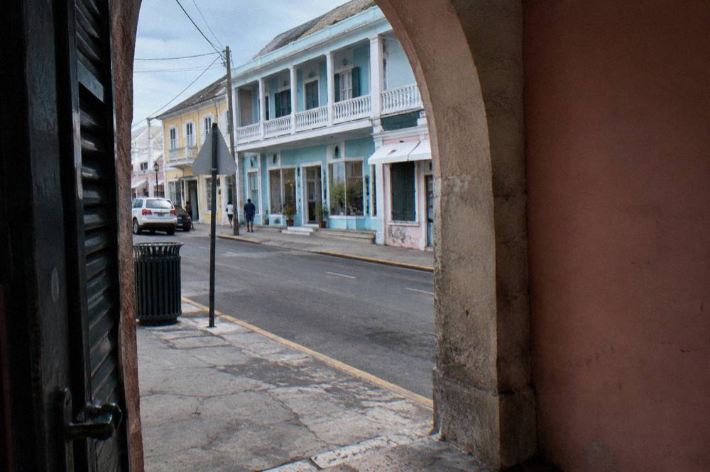 Historic Nassau street corner with colorful colonial buildings in afternoon light