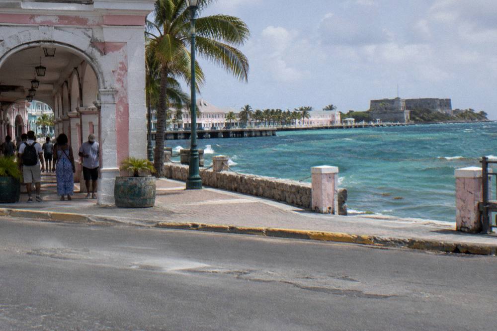 Guided walking group paused on a historic downtown street near a distillery entrance