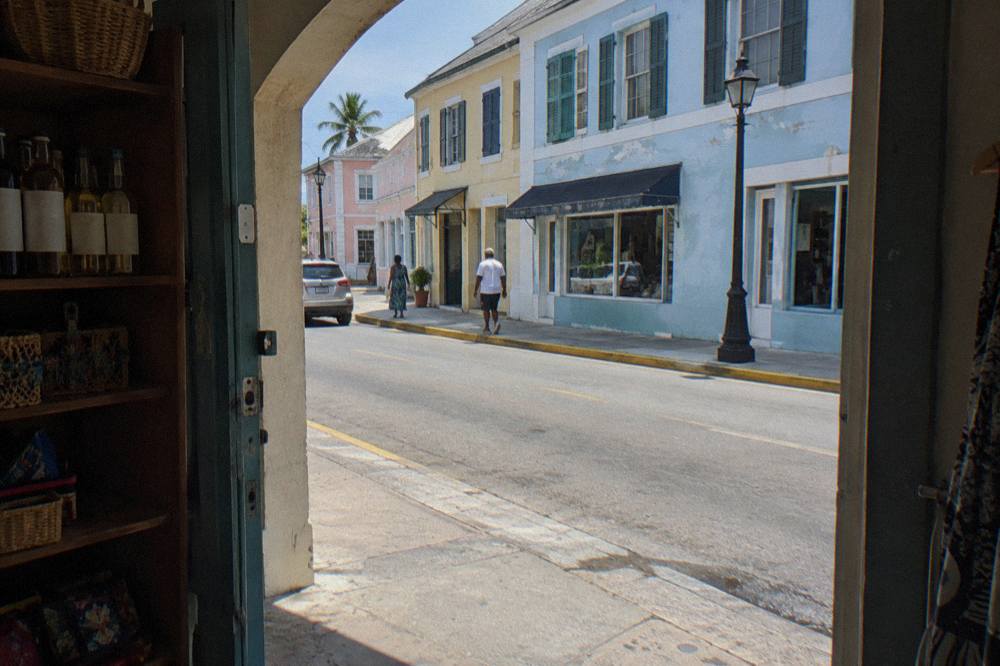 Colorful colonial buildings on a quiet Nassau side street in bright afternoon light