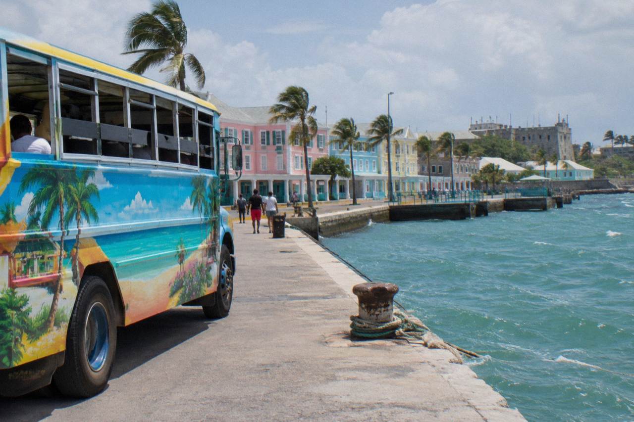 Colorful painted bus parked on a Nassau street near the harbor