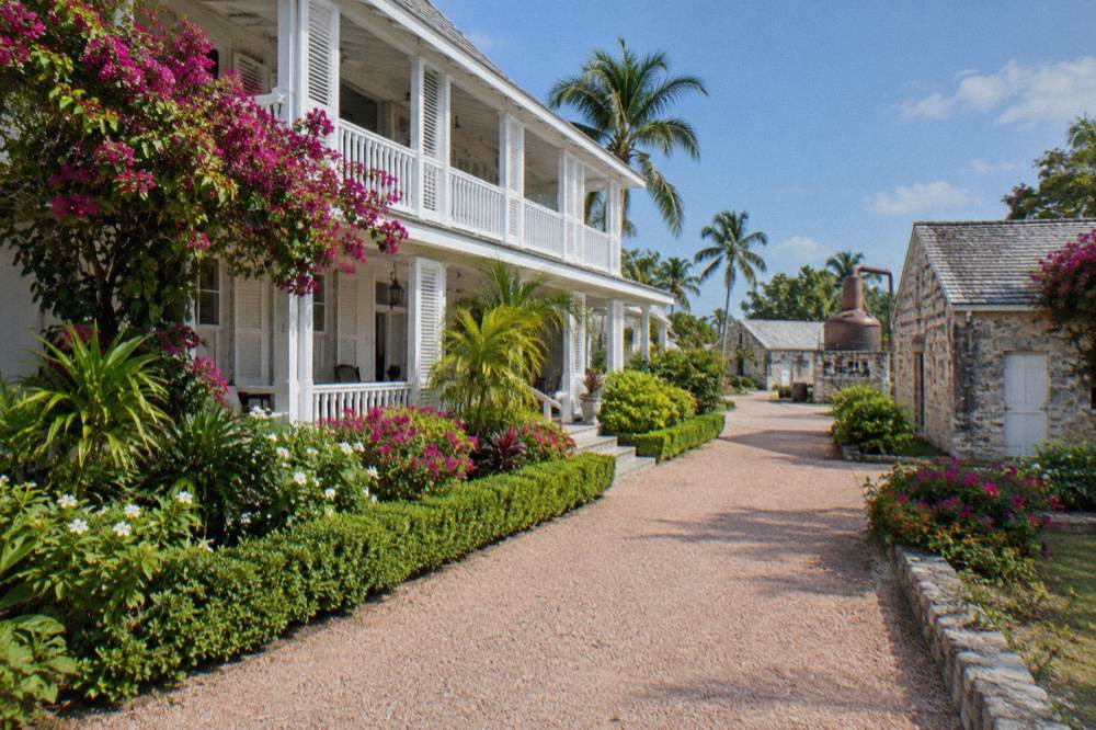 Sunlight on the historic Buena Vista Estate buildings and tropical gardens above Nassau